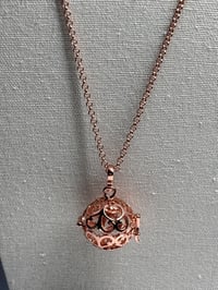 Image 1 of Sphere Locket with Space for Secret Message, Prayer, or Scented Perfume Sample 