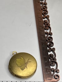 Image 2 of Romantic Keepsake: Yellow Butterfly Photo Locket with Yellow Pressed Flower Inside