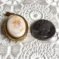 Image 1 of Precious Moments: Gold-Plated Oval Locket Painted Angel Cloud Halo Prayer