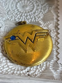 Image 1 of Vintage DC Wonder Woman Gold-Tone Locket Pendant With Blue Stone In Gift Box