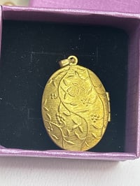Image 1 of Gold-Tone SOS Engraved Oval Locket Pendant With Floral Design In Gift Box