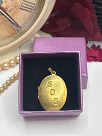 Image 4 of Gold-Tone SOS Engraved Oval Locket Pendant With Floral Design In Gift Box