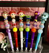 Image 2 of Disney Doorables Toy Story Keychain or Beaded pens ✨