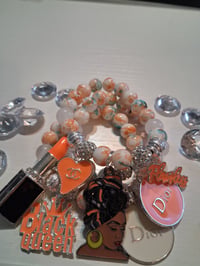 Image 2 of Black queen in orange 