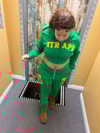 Image 1 of Womans green and yellow itrapp sweat suit.