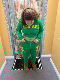 Image 2 of Womans green and yellow itrapp sweat suit.