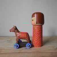 Image 2 of girl with a toy horse X