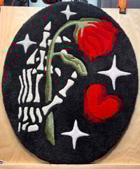 Image 1 of A Rose From a Skeleton