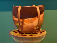 Image 1 of the tan tote bag