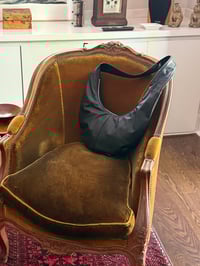 Image 1 of  the black round bag