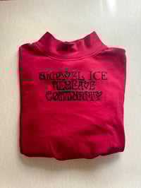 Red “Unravel ice reweave community” long sleeve turtle neck (s/m)