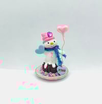 Image 1 of Chocolate Bundt cake snowman with pink heart balloon and teal macaroon