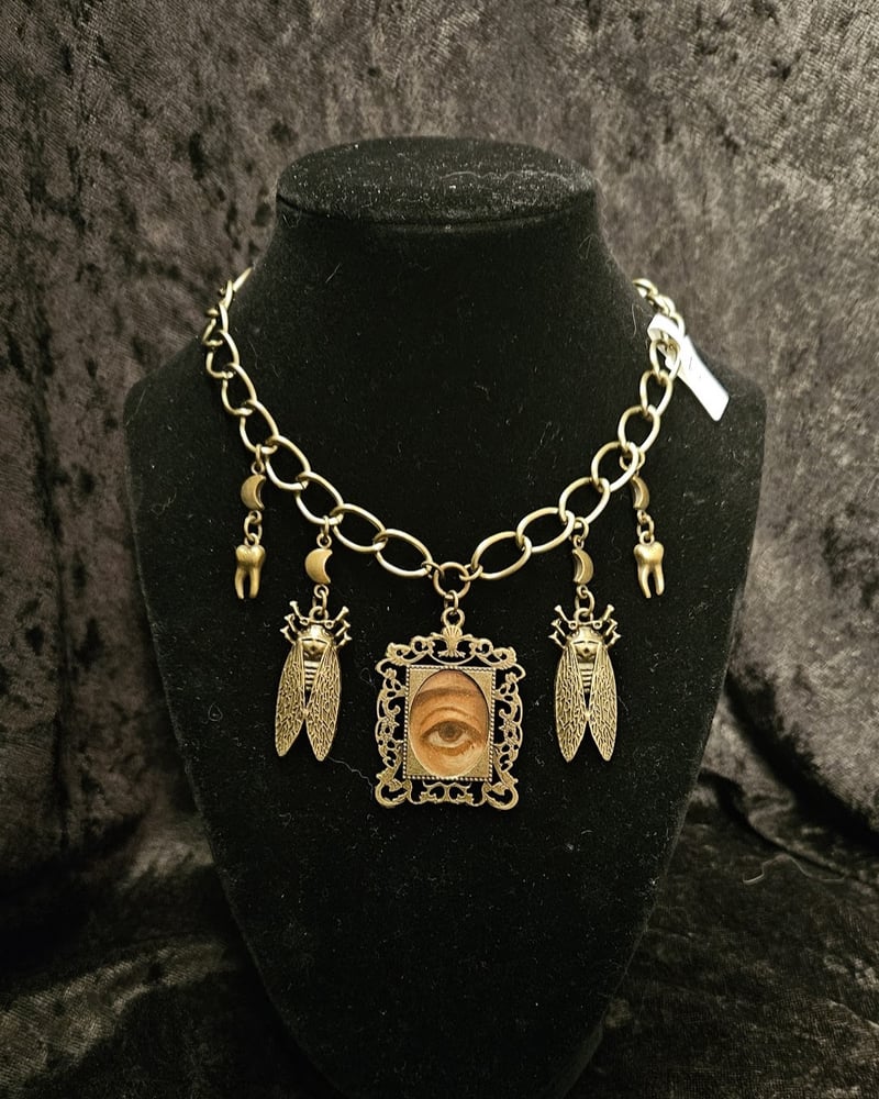 Image of Antique bronze eye on thick bronze chain