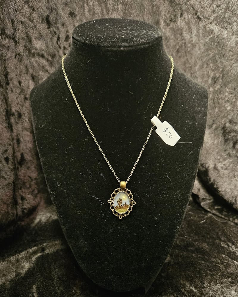 Image of micro landscape on simple bronze chain