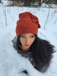 Image 2 of Upcycled Merino Wool Beanie with a Side Bow in Spiced Orange- Youth/Adult Small