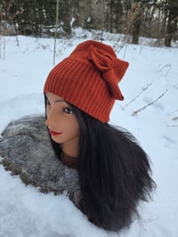 Image 1 of Upcycled Merino Wool Beanie with a Side Bow in Spiced Orange- Youth/Adult Small