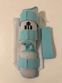 Missile Shield™ Series X Leg Guard(White/Teal)