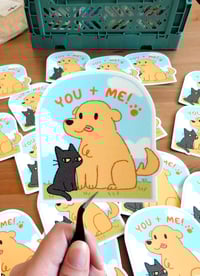 Image 1 of Golden Retriever and Black Cat Sticker