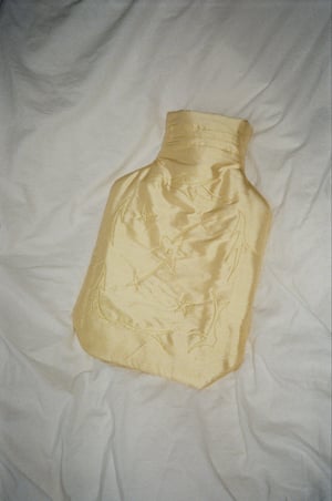 Image of Silk covered hot water bottle