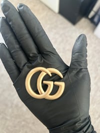 1 x gold mat gg metal flat back  charm.