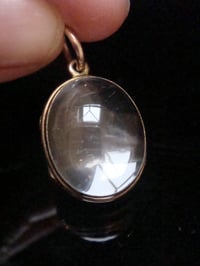 Image 1 of Edwardian 9ct rolled gold heavy thick rounded pools of light crystal locket