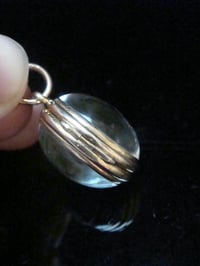 Image 2 of Edwardian 9ct rolled gold heavy thick rounded pools of light crystal locket