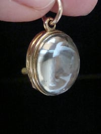 Image 3 of Edwardian 9ct rolled gold heavy thick rounded pools of light crystal locket