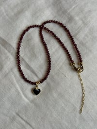 Image 2 of Garnet with Onyx Heart Charm Necklace