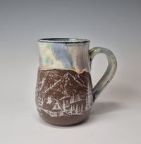 Image 1 of 16 oz. Cozy cabins set in the forest with Snow-covered Colored Lights rim 01202601