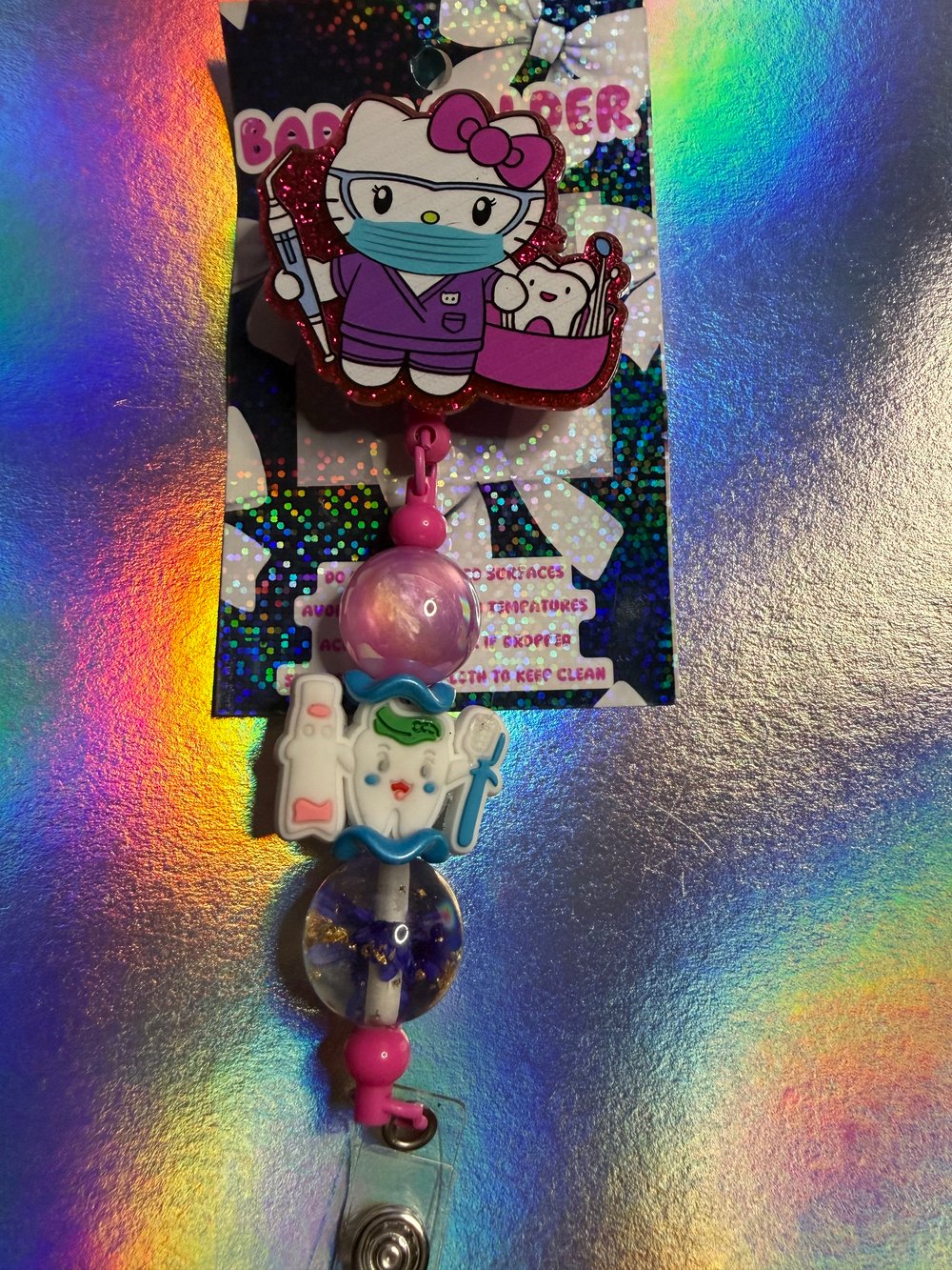 Image of HK dental badge reel