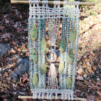 Image 1 of Handmade Macrame Wall Hanging with Ceramic Leaves on Bamboo Rod – Boho Woven Art Decor