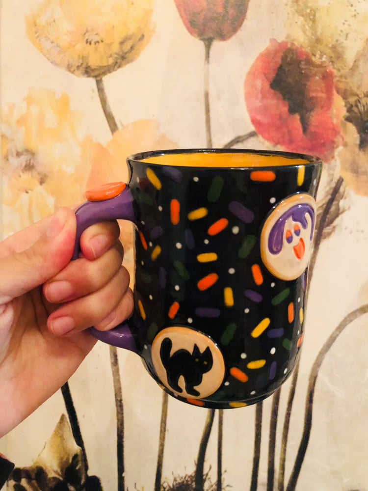 Image of Halloween cookie and creature for Sweet tooth bakery