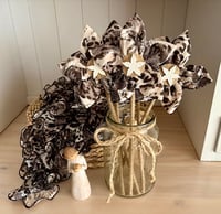 Memory Flowers custom created from a clients loved ones stunning dress blouse