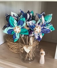 Image 1 of Memory Flowers custom created from a clients loved ones stunning dresses and shirt