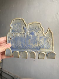 Image 1 of Two Blue Dogs in a Blue Yard with Blue Flowers Wall Hook