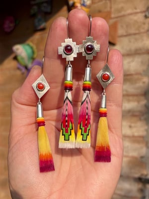 Image of Yellow feathers with red coral