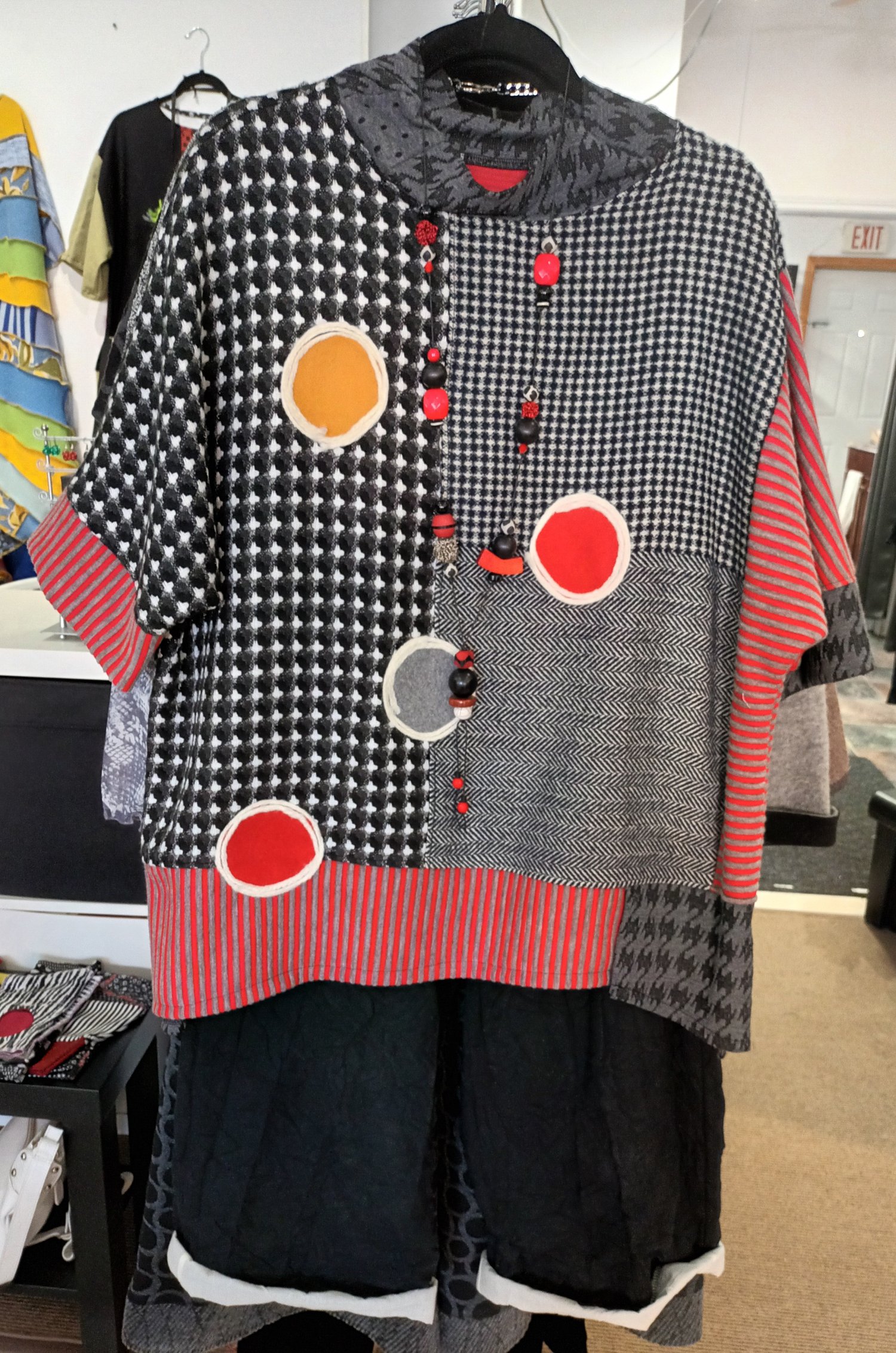 Image of black, red and white color block sweater
