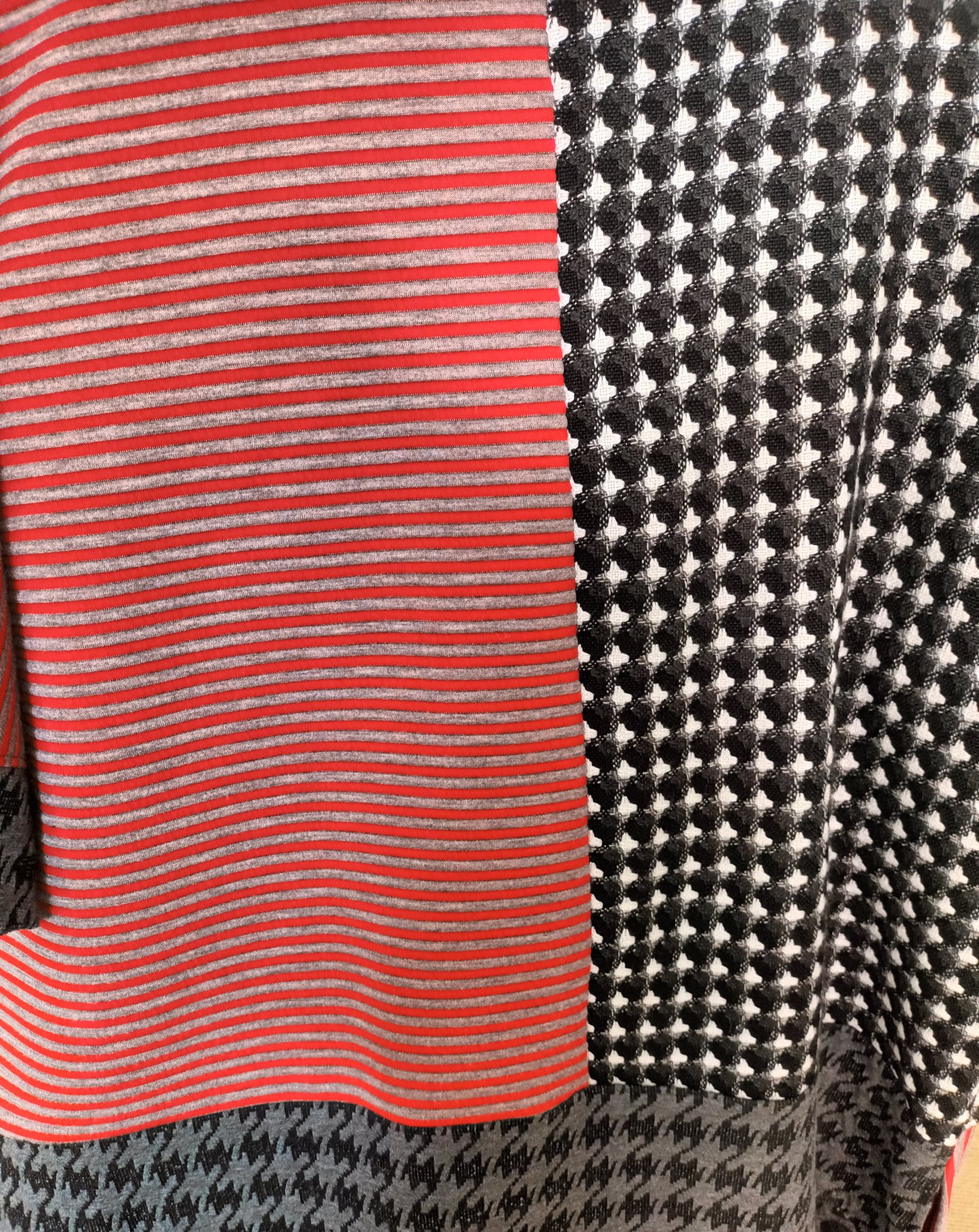 Image of black, red and white color block sweater