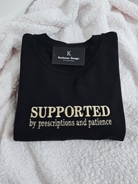 Image 1 of SUPPORTED BY PRESCRIPTIONS sweater