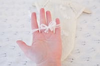 Image 4 of Penny Knit Romper bow white with tieback
