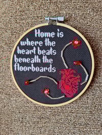 Image 1 of Home is where the heart beats beneath the floorboards Poe Inspired Hoop