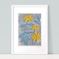Yellow Rudbeckia - blue leaves and textured ground