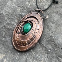 Image 1 of Transformation. Limpet inspired pendant with malachite stone