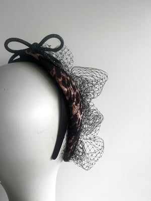 Image of Leopard fabric covered headpiece