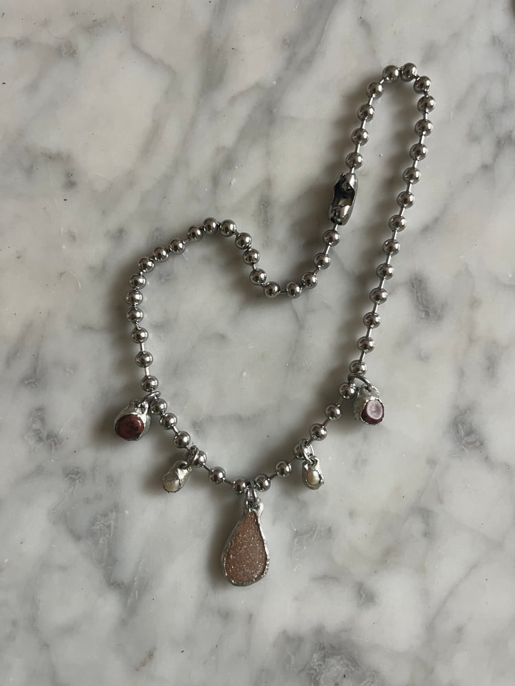 Image of  PEBBLES PEARLS AND A GEODE SLICE