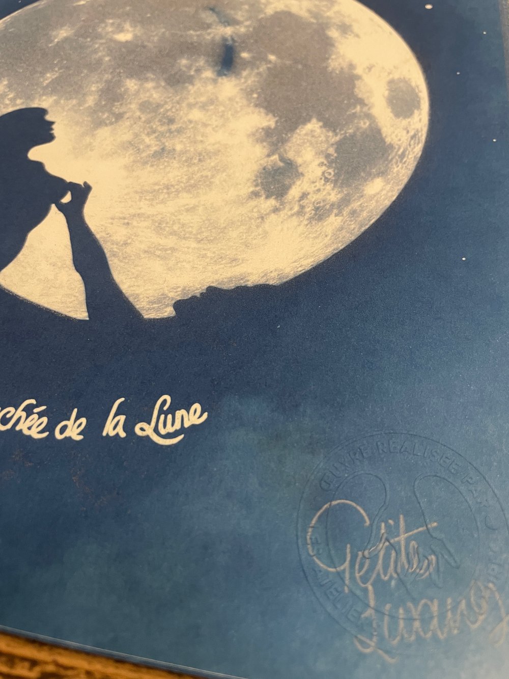 Image of "La Fesse Cachée de la Lune" phosphorescent cyanotype  