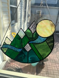 Image 1 of Moon over snow capped mountains 