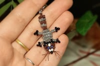 Image 1 of Raccoon charm