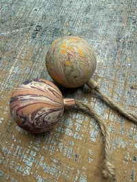 Image 1 of 2 x Round wooden hand marbled baubles 