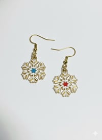 Image 2 of Gold Snowflake Dangle Earrings – Red and Green Enamel Stars